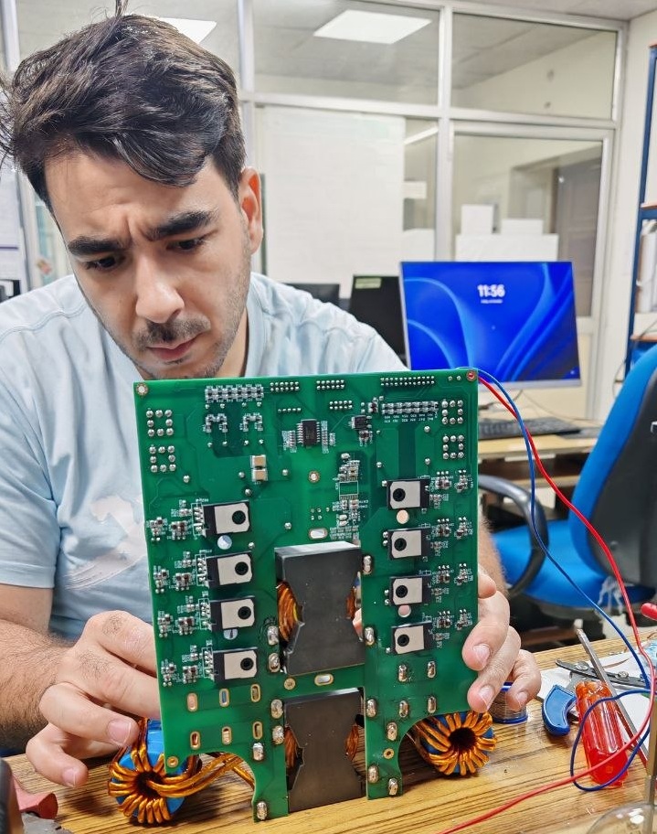 Ali H. Mahmoud inspecting a SiC inverter gate-driver board in the ADMIRE Lab, IIT Roorkee